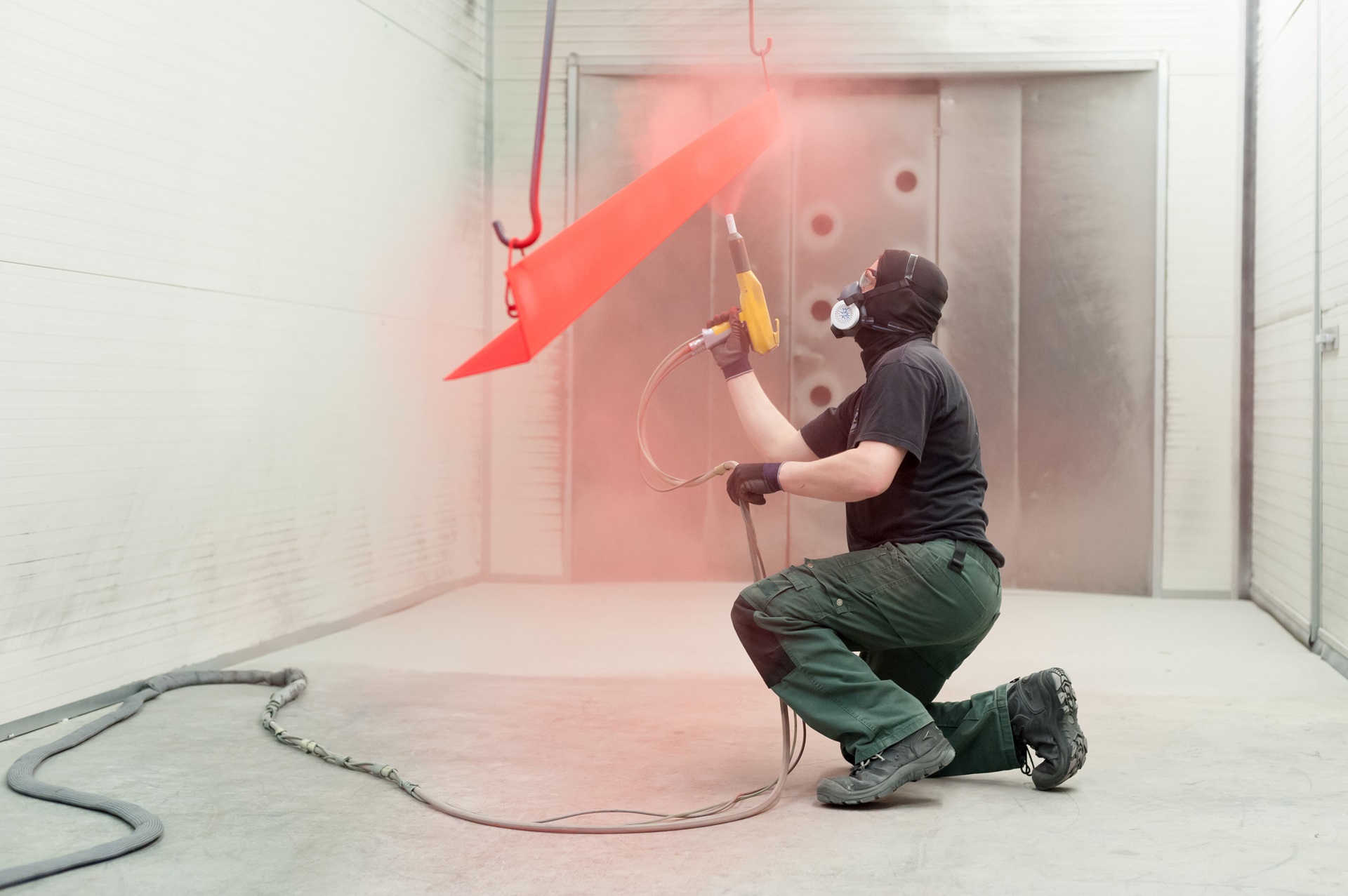 Image of a man coating a steel